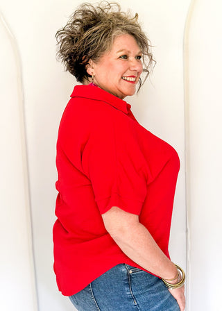 Red collared top with v-neckline 