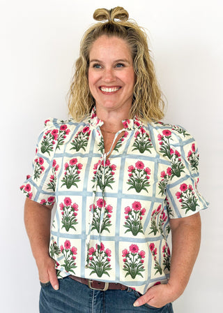 Puff sleeve top with off white background and soft blue grid pattern-large magenta florals with green stems/leaves in each grid-ruffle collar-tie neck