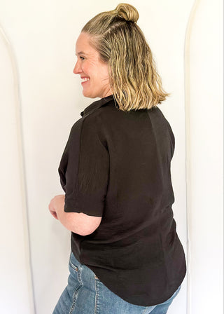 Black collared top with v-neckline