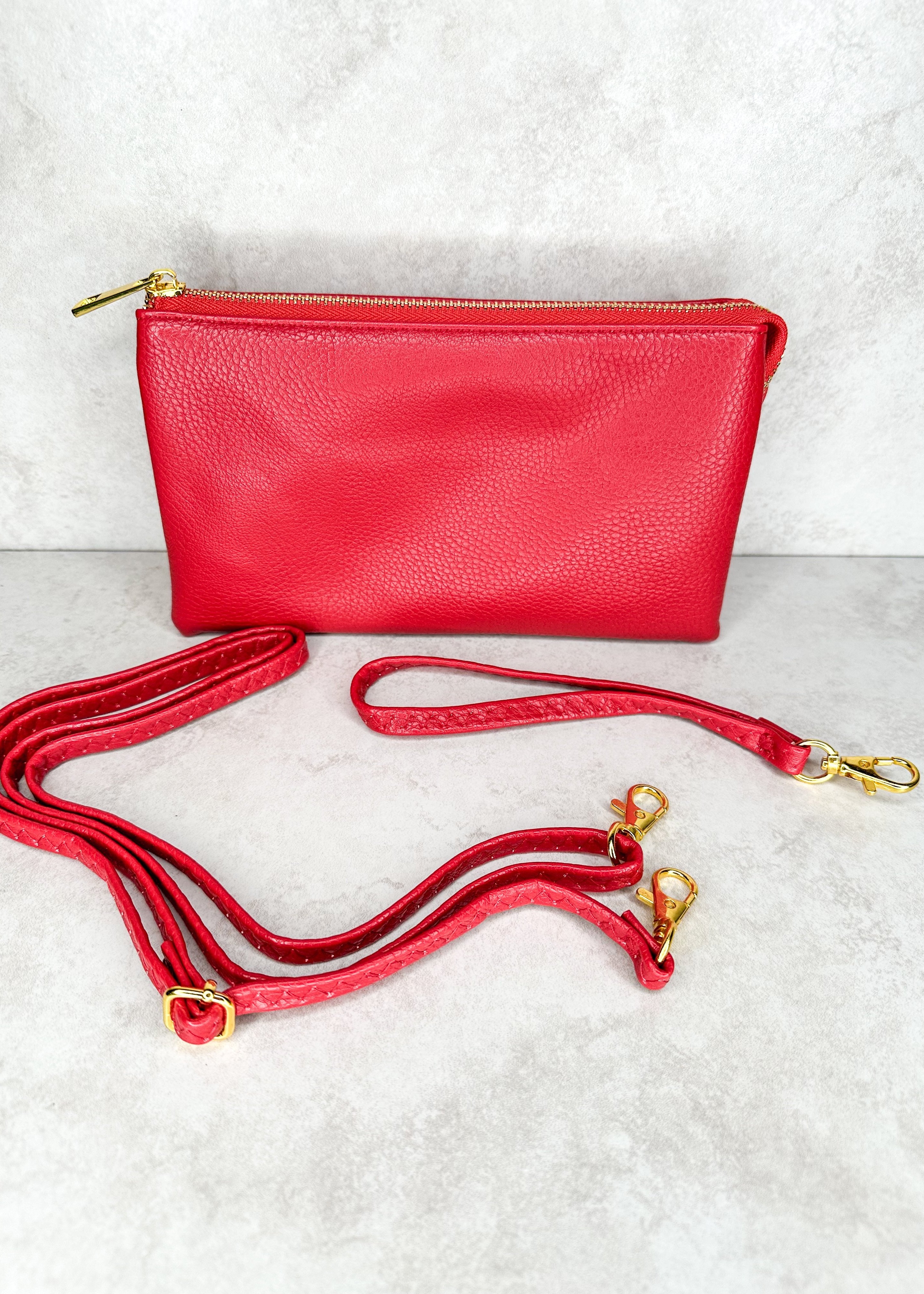 Crossbody bag with zipper, gold hardware, pockets inside, comes with wrist strap and shoulder strap, both straps removable - red