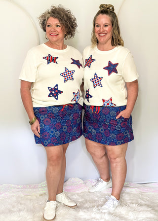 Women’s red white and blue skort with elastic waistband, drawstring, and built-in shorts