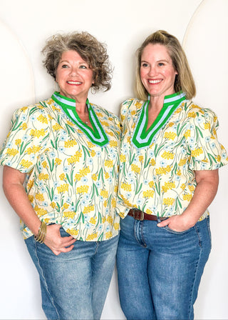Spring floral top with short sleeves, easy silhouette, and colorful yellow, blue and green.