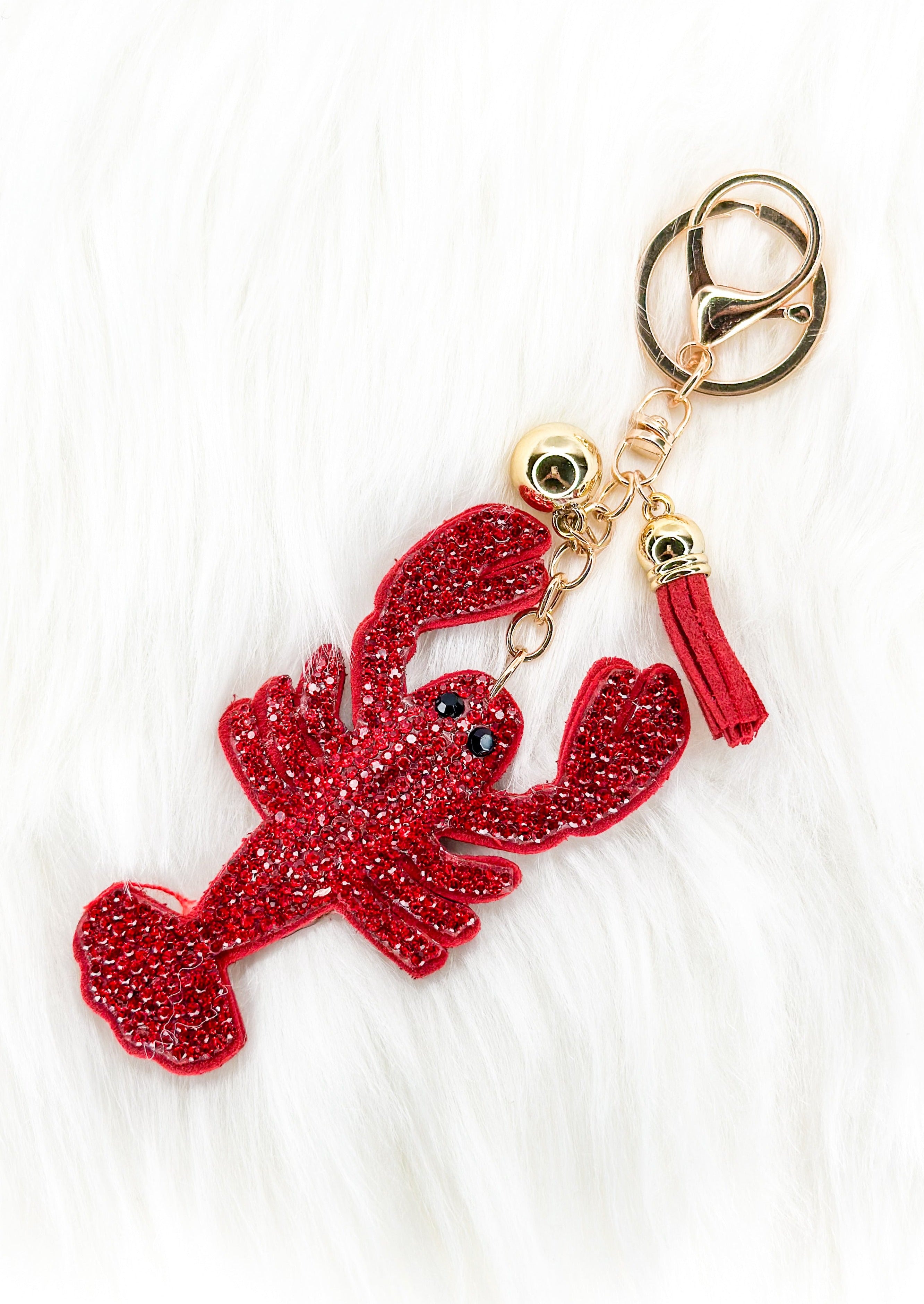 red sparkly crawfish keychain with tassel and gold hardware