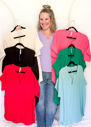 Solid textured blouse with a V-notch neckline, short sleeves in all colorways