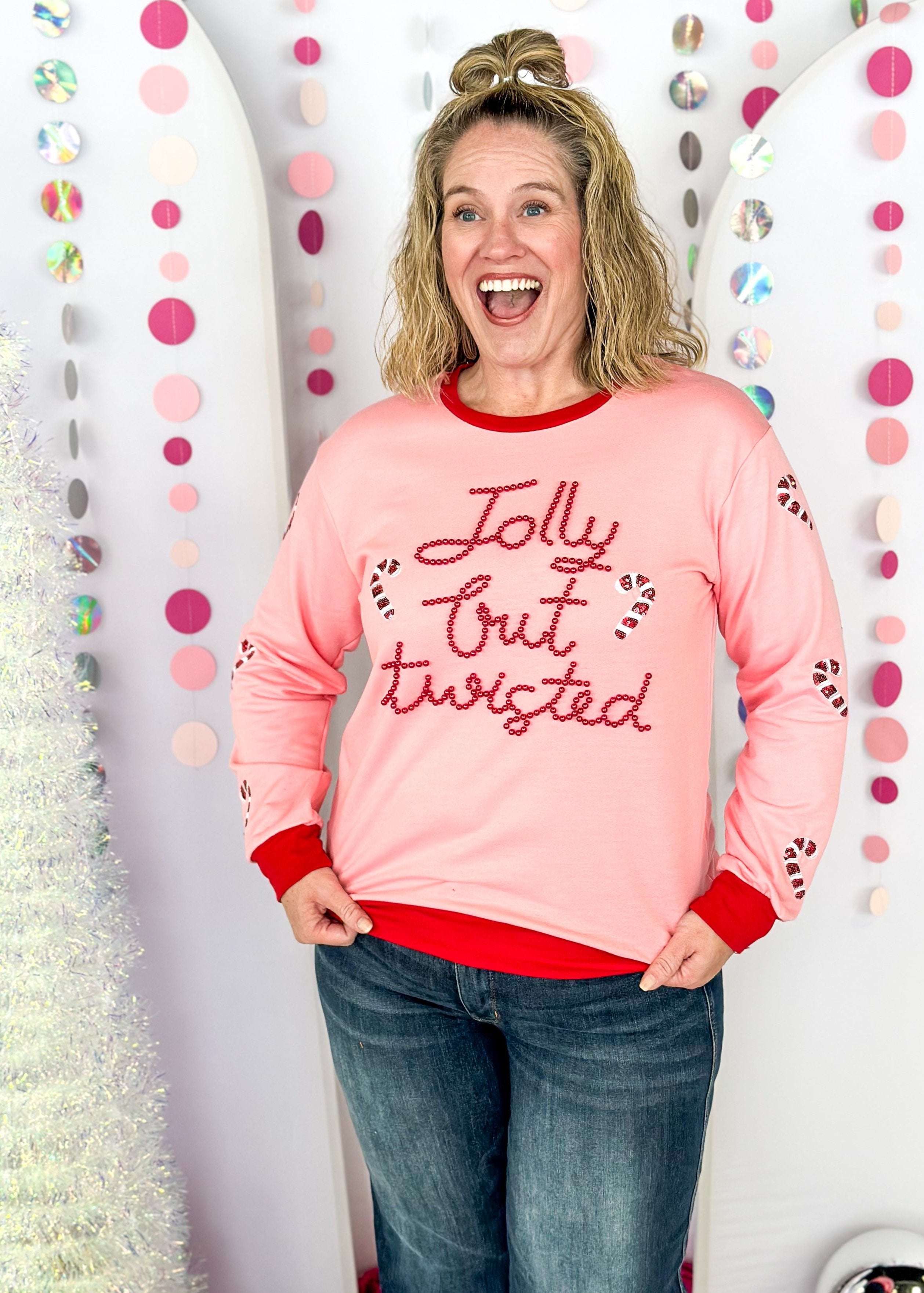 light blue long sleeve top - thicker than a tee shirt but not as thick as a sweatshirt - better not pout spelled out in pink sequins across the front - pink and blue present sequin patches down the sleeves