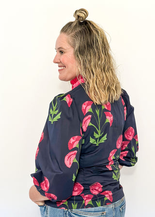 navy floral button up top with pink flowers and 2 shades of pink trim/ruffles along collar and down center