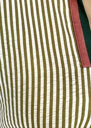 Short sleeve vertical striped shirt in olive.  V-neck ribbon collar. 