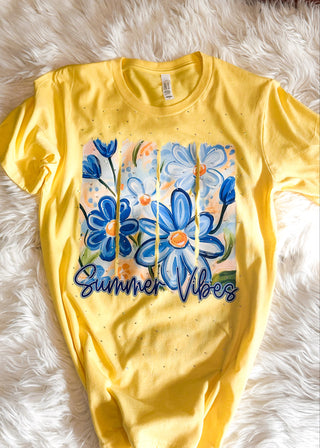 Yellow graphic tee with blue florals, rhinestone detail and "Summer Vibes" letting 