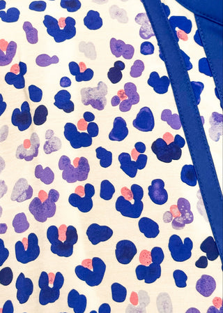 Close up of patterned leopard top with easy silhouette and statement neckline