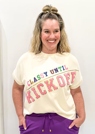 cream short sleeve crop tee with "CLASSY UNTIL KICKOFF" in chenille and sequin detail. 