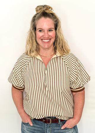 Short sleeve black and off white vertical stripes, zip front collar.  Collar and sleeve has contrast trim with bold stripe