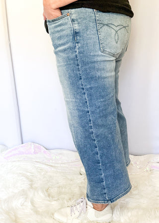 Light blue Judy Blue cropped wide leg jeans with vintage pocket design, soft wash, and mid rise waistband.