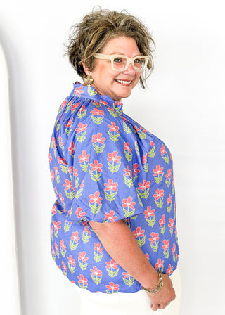 periwinkle floral top with puff short sleeves and v-neck