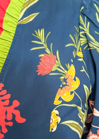 floral long sleeve top with navy background and redish and gold blooms - red and green ruffle around collar and down front - button up