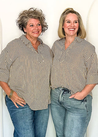 Two women modeling a gingham top in brown.