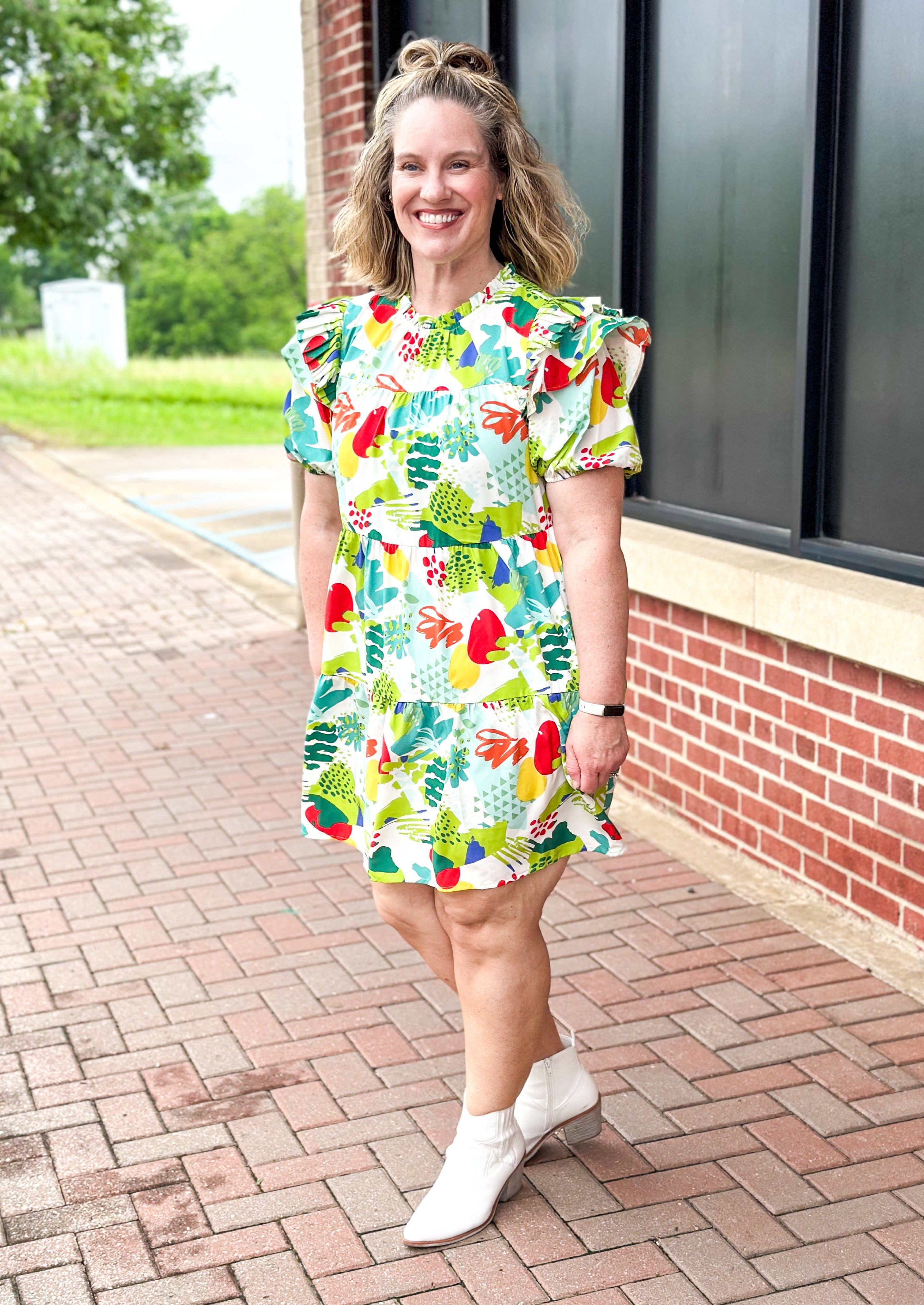 Greens, red, yellow, teal abstract print on white background dress - ruffle neck and ruffle on shoulder of short balloon sleeve - tiered