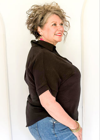 Black collared top with v-neckline