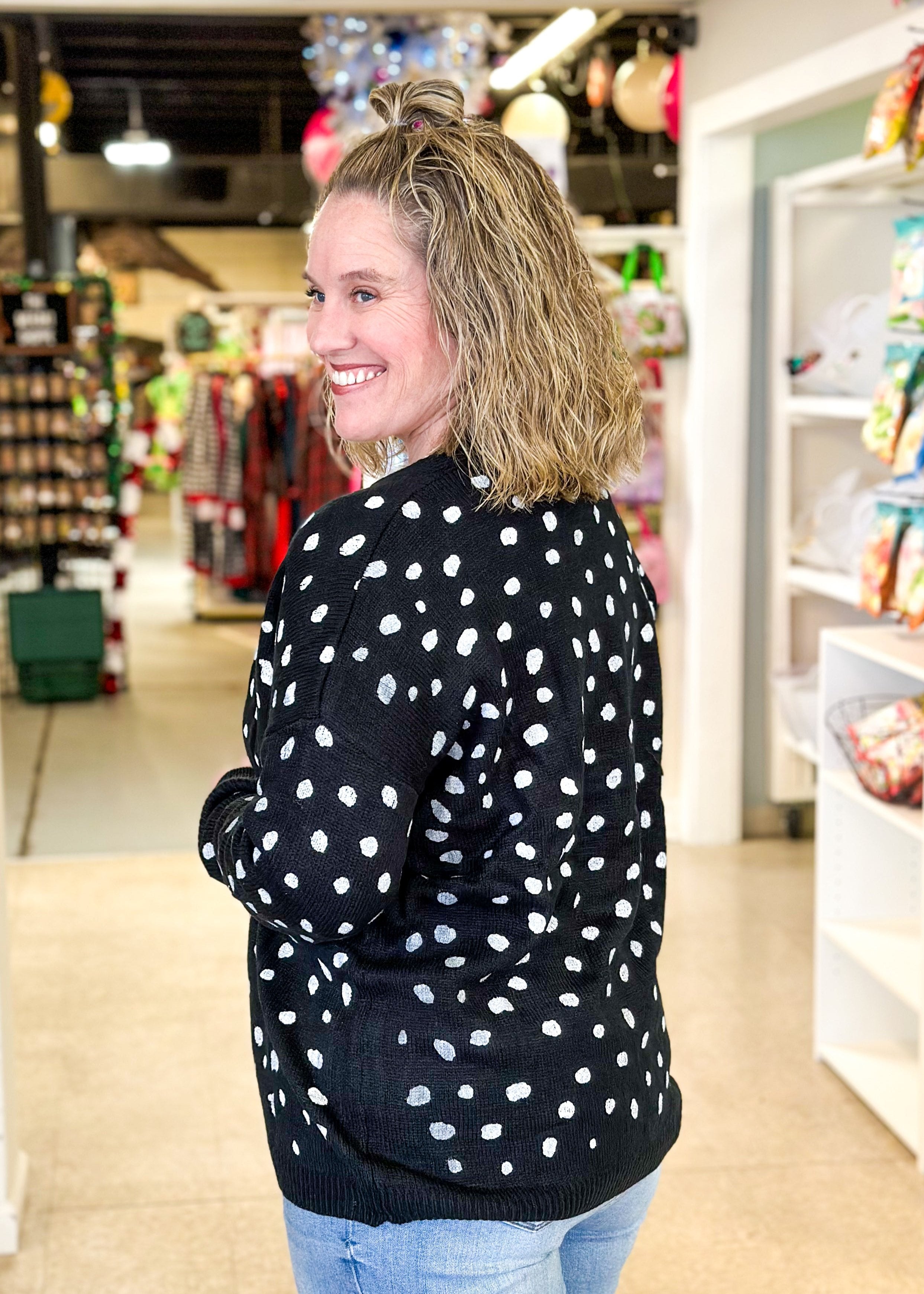 open black cardigan sweater with white spots like a dalmation 