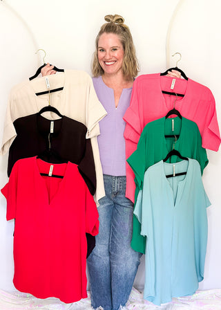 Solid textured blouse with a V-notch neckline, short sleeves in all color ways