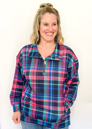 Bright plaid quarter-zip pullover in navy, teal, and pink with front pockets.