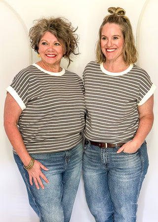 wide striped top with cuffed sleeves, and white banded rounded neckline.