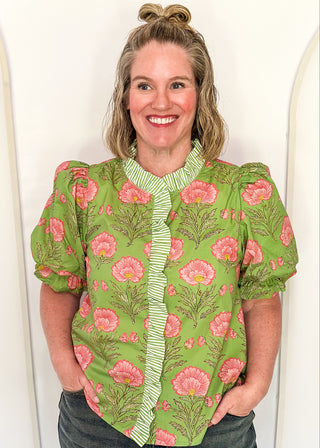 matcha green floral puff sleeve blouse with pink oversized floral print and striped contrast trim along the neckline and front placket.