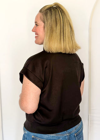 Black scuba athleisure top with gold zip neckline and relaxed fit