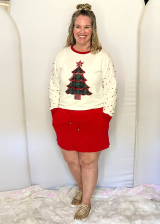 Bright red ribbed skort with drawstring waist and side pockets.