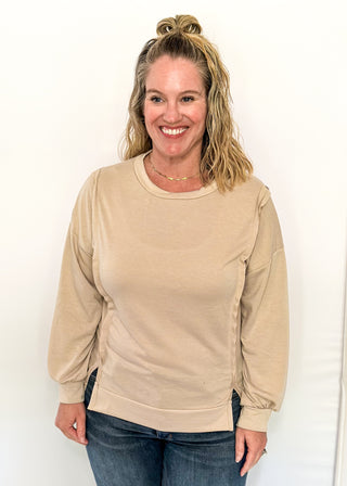 round neck oversized long sleeve with band cut edge detail with slits. 