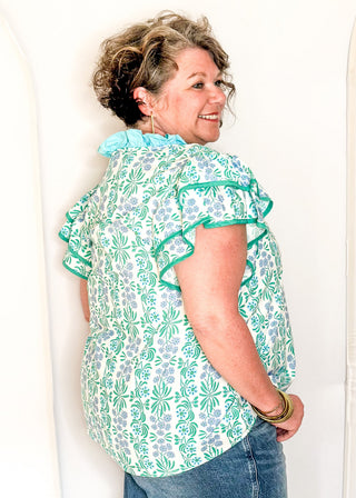 Floral print top with decorative neckline and short ruffle sleeves