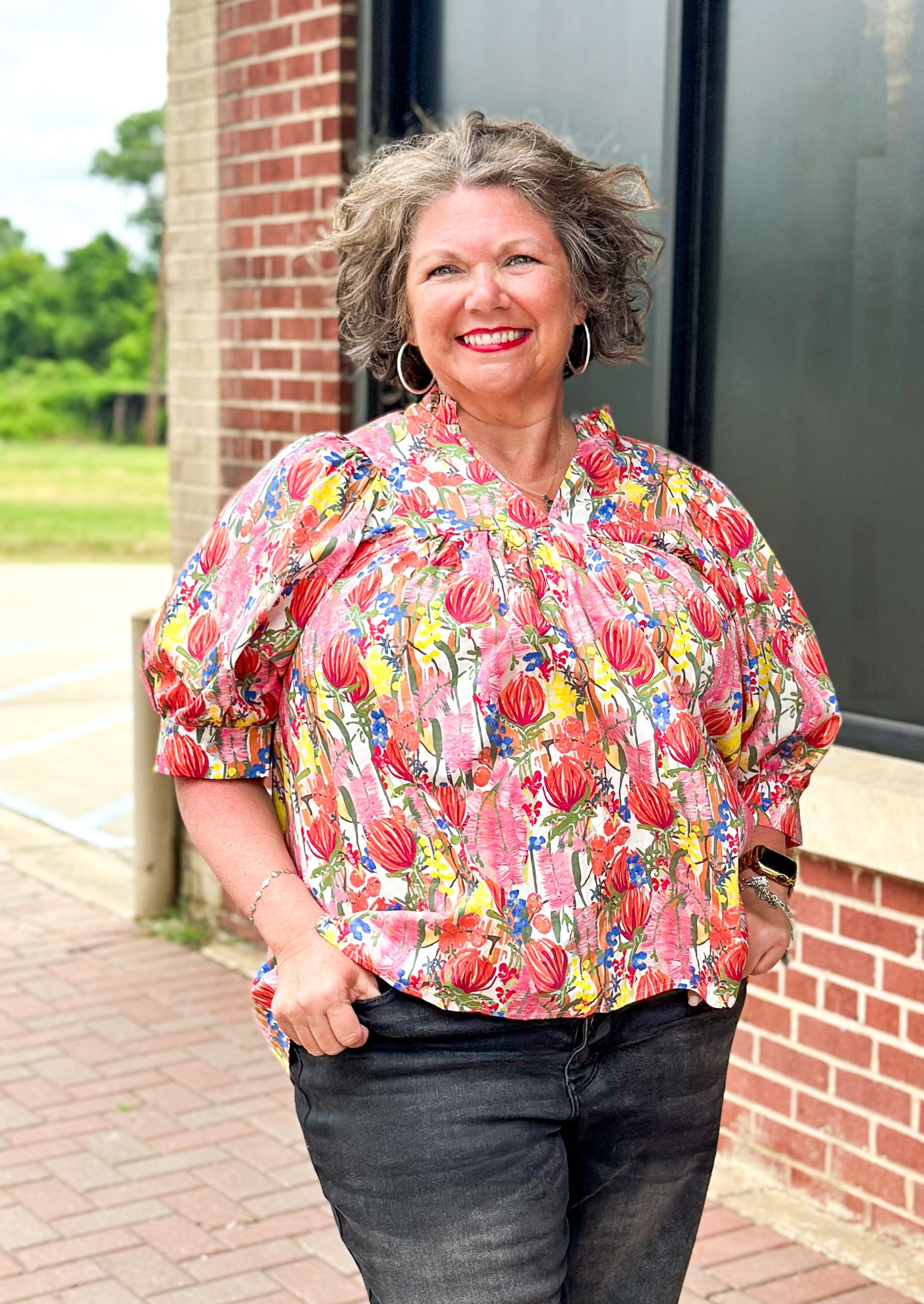 floral print short puff sleeve top with banded cuff w/button - v-neck - ruffle color - florals in red, yellow, pinks, blue