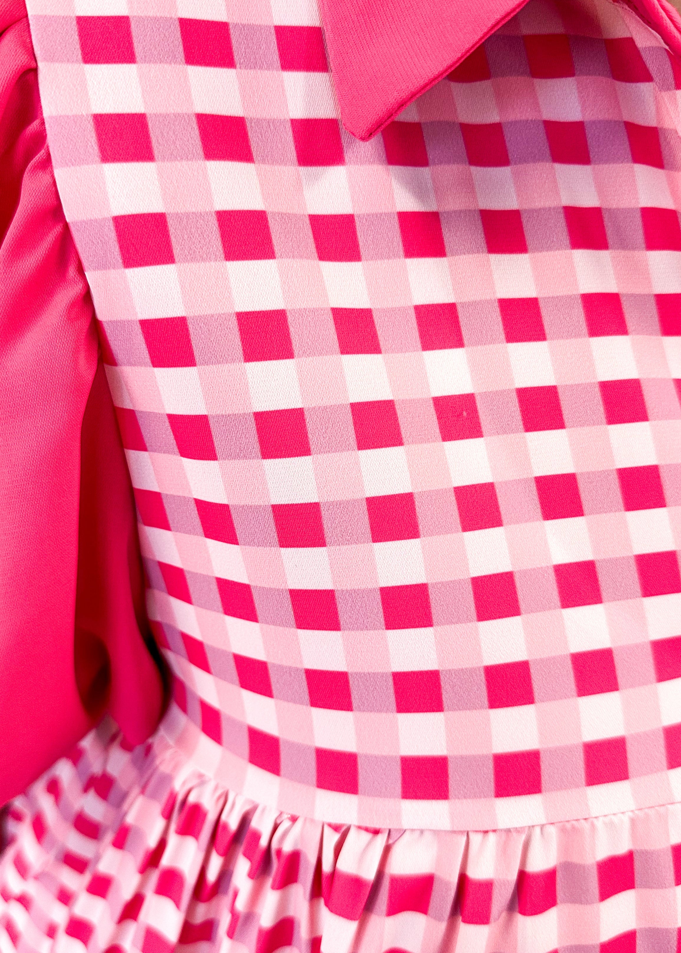 pink gingham tiered dress with solid pink collar and puff sleeves - functional buttons down the front - pockets