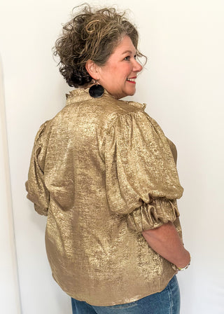 Shimmer gold lightweight button up blouse with collared neckline and ruched sleeves.