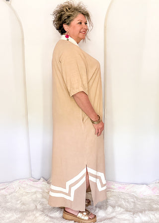light brown short sleeve maxi dress with white contrast collar and detail with pockets. 