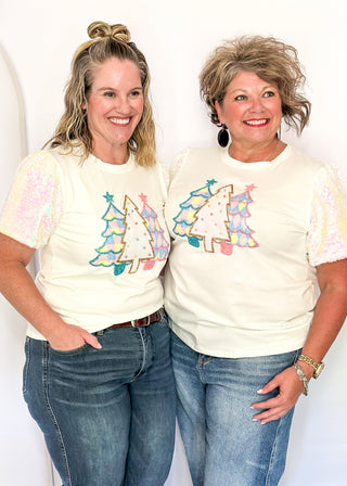 Short sleeve top with iridescent sequin sleeves and pastel sequin Christmas tree appliqués on the front.