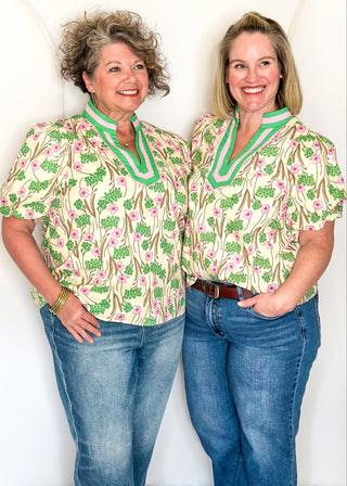 Spring floral top with short sleeves, easy silhouette, and colorful pink and green pattern