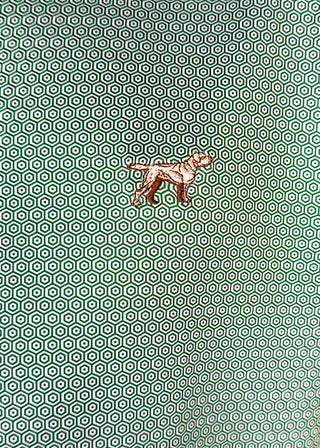 Close up of Green Polo with diamond geometric design.