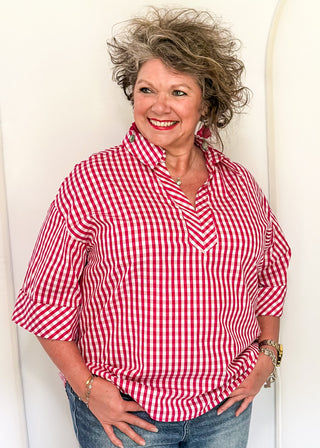 Gingham blouse with split neckline, collar, and 3/4 sleeves.