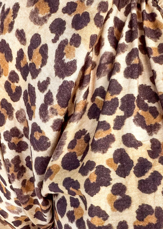 Short sleeve lightweight V-neck blouse in a leopard print. 