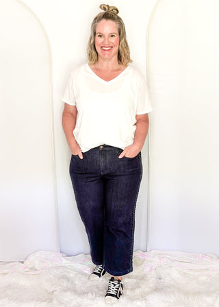 Women's Judy Blue dark wash jeans with braided side trim, high-rise waist, and classic five-pocket styling.