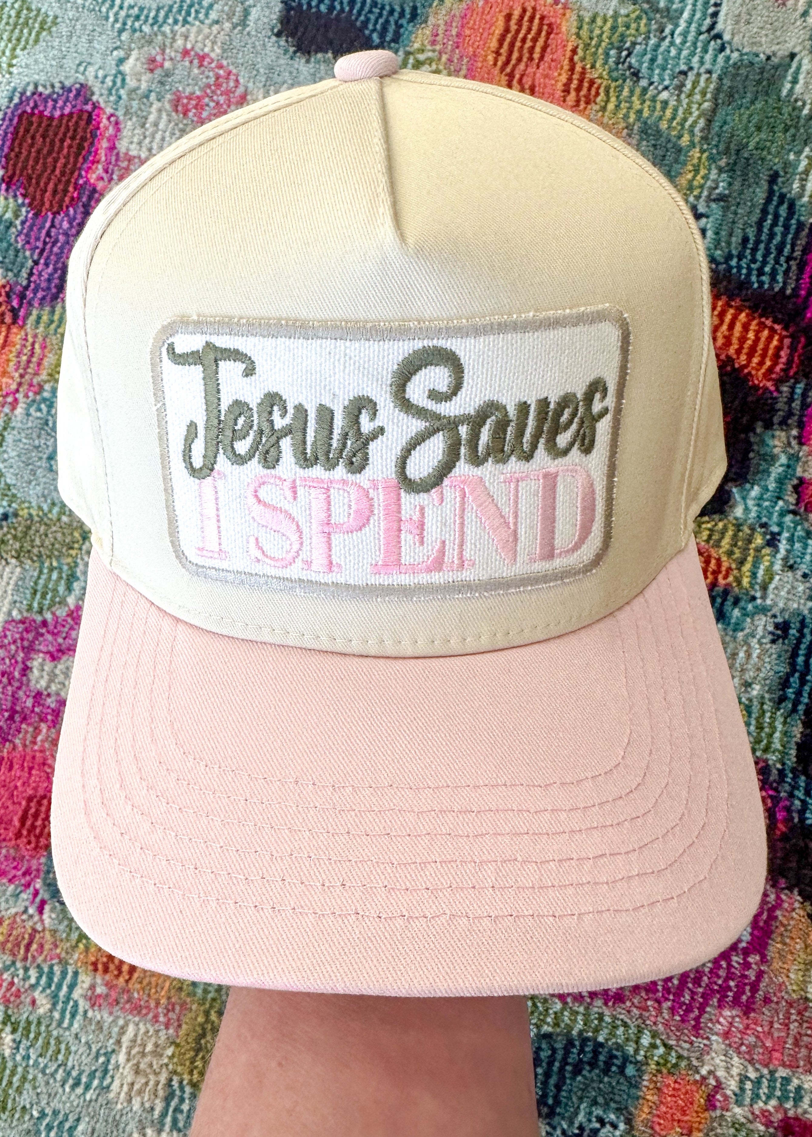 Embroidered "Jesus Saves I Spend" patch on a retro style baseball hat with pink bill.

Snap closure.