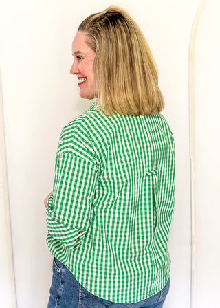 Gingham blouse with split neckline, collar, and 3/4 sleeves.