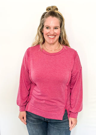 Round neck oversized loose fit long sleeve with band cut edge detail with slits. 