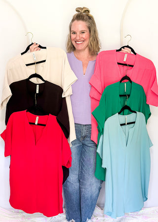Solid textured blouse with a V-notch neckline, short sleeves in all colorways
