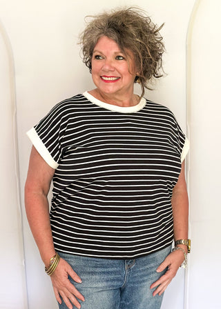 wide striped top with cuffed sleeves, and white banded rounded neckline.