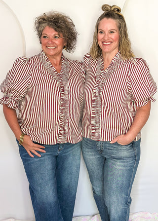 two models wearing short sleeve striped top with jeans.