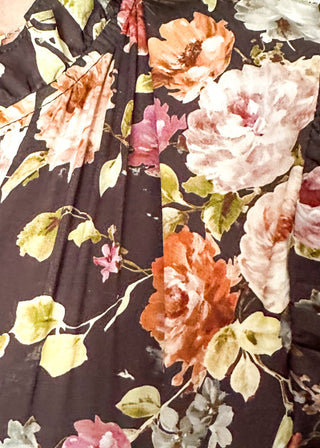 Brown with fall florals, short sleeve tiered maxi dress.  V-neck and puff sleeve and lined. 