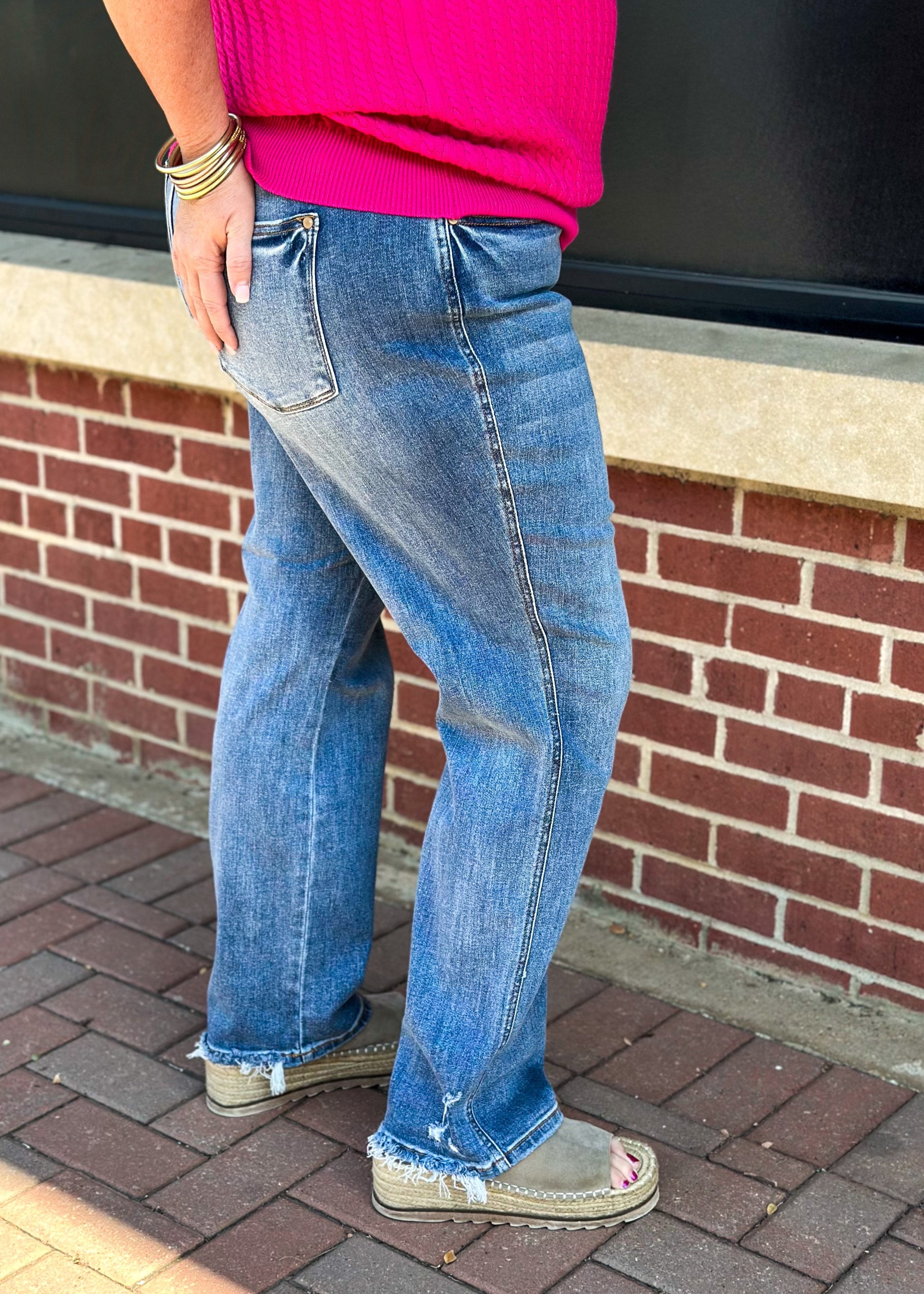 judy blue "dad" jeans - mid rise - slight distressing at the hem - relaxed fit - button and zipper closure - front and back pockets with hidden cell phone pocket above right back pocket