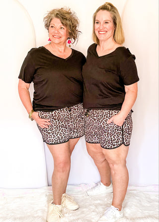 Leopard print athletic shorts with black trim
