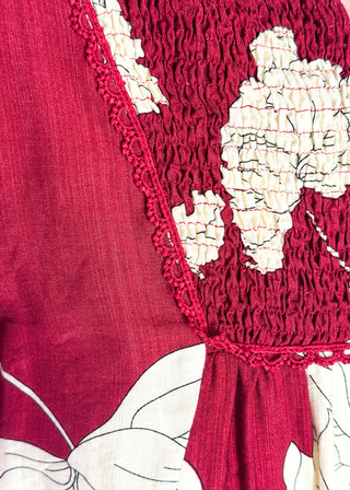 close up of longsleeve burgundy floral top